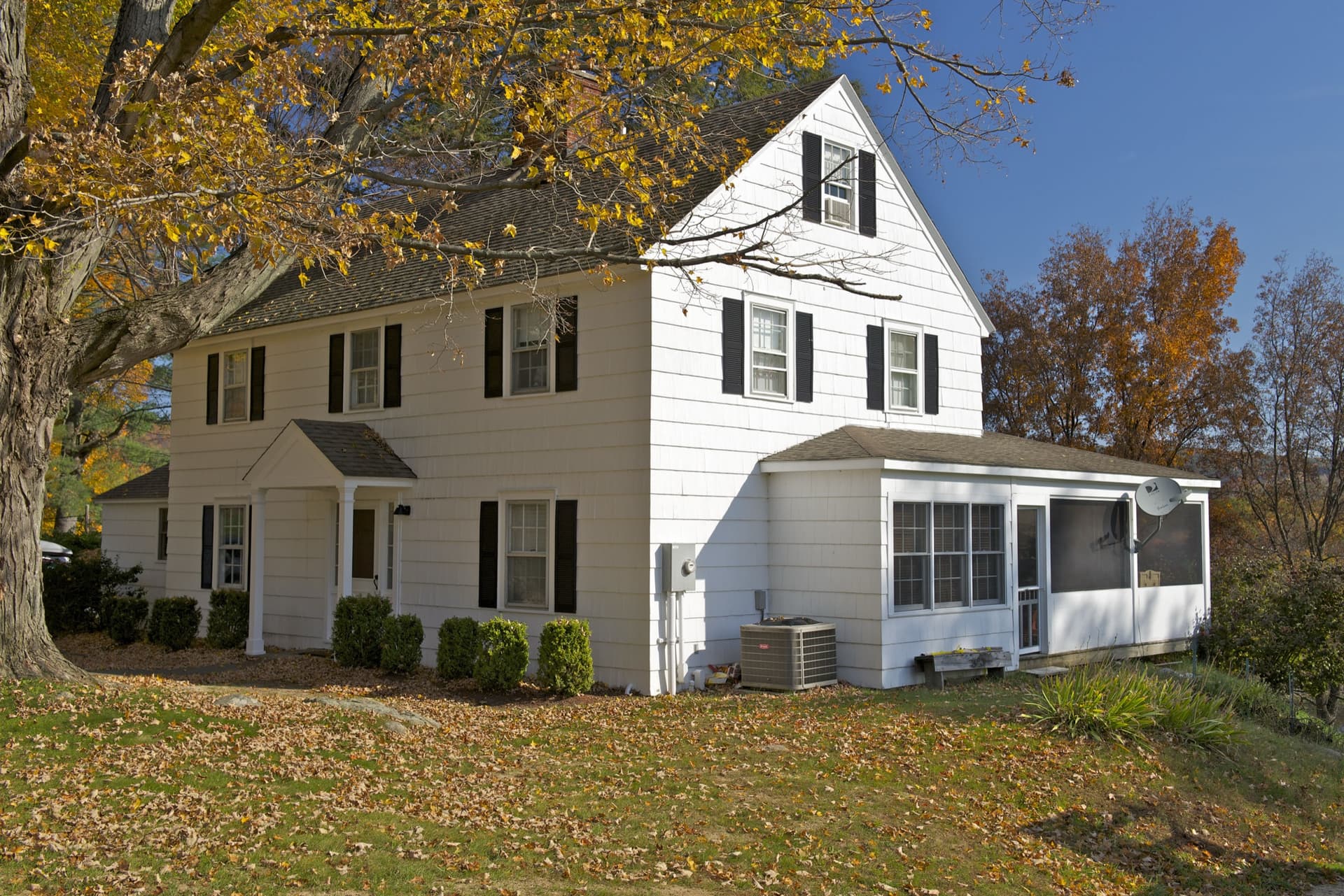 New England Colonial home with a freshly installed roof